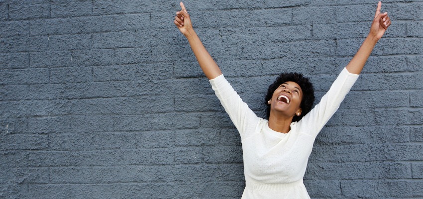 happy woman with her arms outstretched