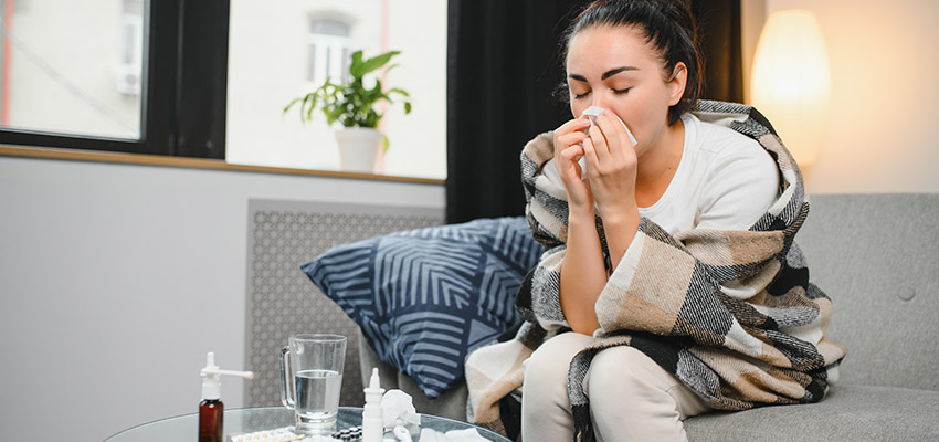 woman blowing her nose